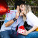 Picture of romantic couple outside with balloons on Valentines Day